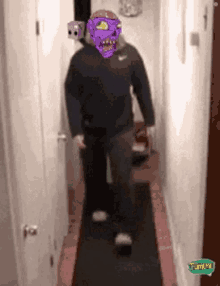 a man wearing a purple mask is walking down a hallway