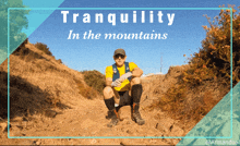 a man sits on a rocky path with tranquility in the mountains written on the bottom