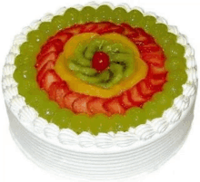 a fruit cake with strawberries , kiwi , and grapes on a white background .