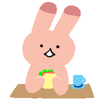 a pink bunny is sitting at a table with a cup of coffee