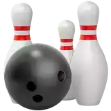 a bowling ball and three pins with red stripes