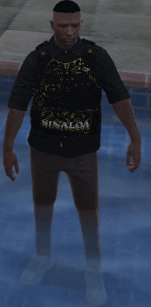 a man wearing a sinaloa shirt is standing in the water