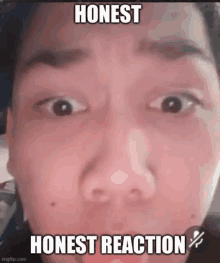 a close up of a man 's face with the words `` honest reaction '' written on it .