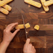 a person is cutting a piece of food on a cutting board with mr. cookies written on the bottom right