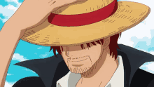 a man with red hair and a straw hat