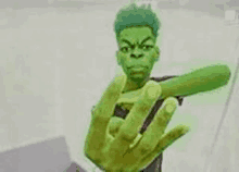 a cartoon of a man with green hair and a green hand giving the middle finger .