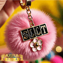 a keychain with the word suct written on it