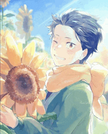 a boy with a scarf around his neck holding a sunflower