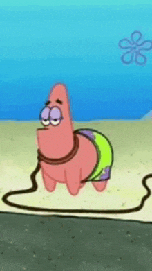 patrick star from spongebob squarepants is tied to a rope .