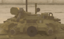 a blurred image of a military vehicle with a lot of guns on it