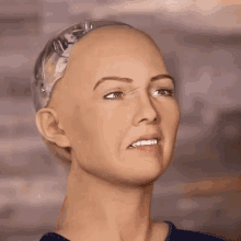 a close up of a woman 's face with a robot head