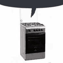 a gas stove with a black oven and a speech bubble above it .