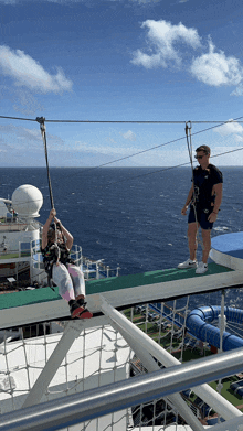 a woman is riding a zip line on a boat