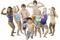 a group of children in swimsuits are flexing their muscles and smiling