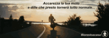 a man riding a motorcycle down a road with the words accarella la tua moto