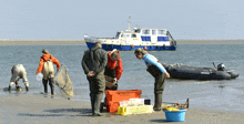 a group of people on a beach with a boat in the background that says ' dutch '