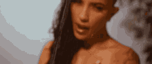 a close up of a woman 's face with long hair