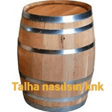 a large wooden barrel with the words talha nasilsin knk written on it