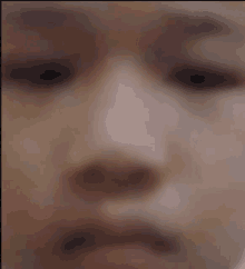 a blurry photo of a person 's face with their eyes closed