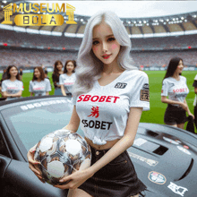 a woman is holding a soccer ball and wearing a shirt that says sbobet