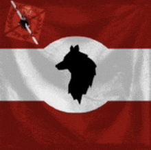 a red and white flag with a silhouette of a wolf