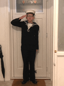 a boy in a sailor uniform salutes in front of a door that says penalty