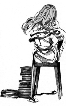 a girl is sitting on a stool next to a stack of books .