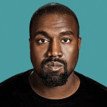 a close up of a man with a beard wearing a black shirt on a blue background .