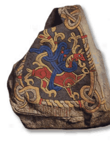 a rock with a painting of a deer and a dragon on it