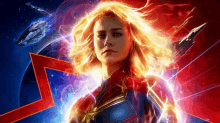 a poster for captain marvel shows a woman in a red and blue suit