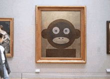 a painting of a monkey with big eyes is on display