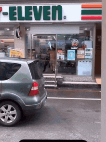 a 7 eleven store with a car parked outside