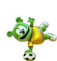 a gummy bear is doing a handstand on a soccer ball