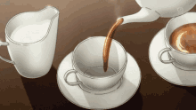 a cup of coffee is being poured into a cup on a saucer .