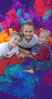 a group of children are posing for a picture with a colorful background