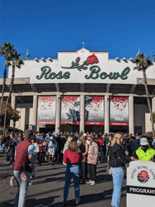 a crowd of people are gathered outside the rose bowl