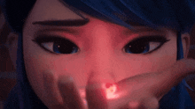 a close up of a cartoon girl 's face with a red light coming out of her nose .