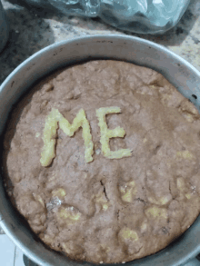 a brownie in a pan with the word me on it