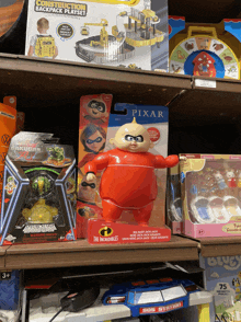 a shelf full of toys including a pixar jack jack toy