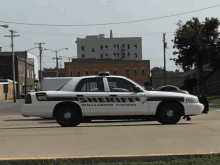 a williamson county sheriff 's car is parked on the street