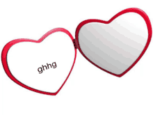 a pair of heart shaped mirrors with ghhg written on one of them