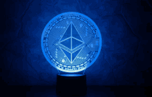 a blue coin with a diamond in the center and the words ethereum decentralized digital currency