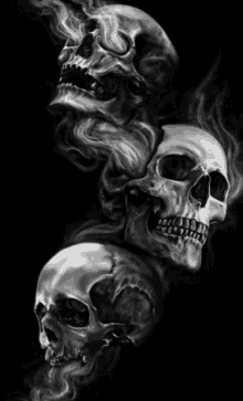 three skulls on a black background with smoke coming out of them