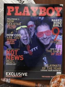 a playboy magazine with a picture of two people on it