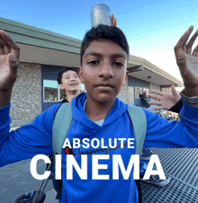 a boy with a can on his head and the words absolute cinema above him