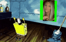 a cartoon of spongebob and a mop with a picture of a woman in the background