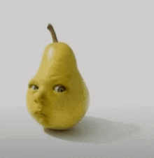 a pear with a face on it looks like a baby