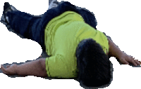 a man in a green shirt is laying on his back