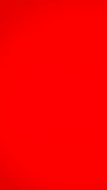 a close up of a red background with a plain red color .