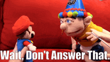 a mario puppet is talking to another mario puppet with the words wait don 't answer that